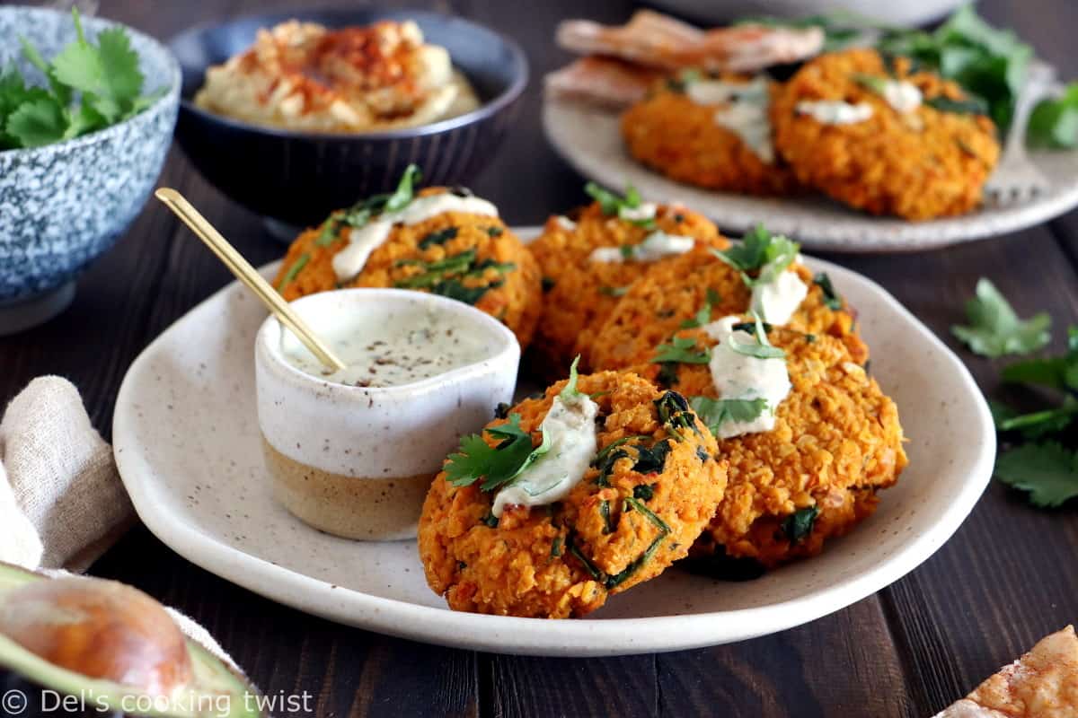 Easy and delicious red lentil patties served with a garlic-herb tahini sauce. Both vegan and gluten-free, these veggie patties are bursting with savory flavors, hearty texture, and oodles of plant-based protein.