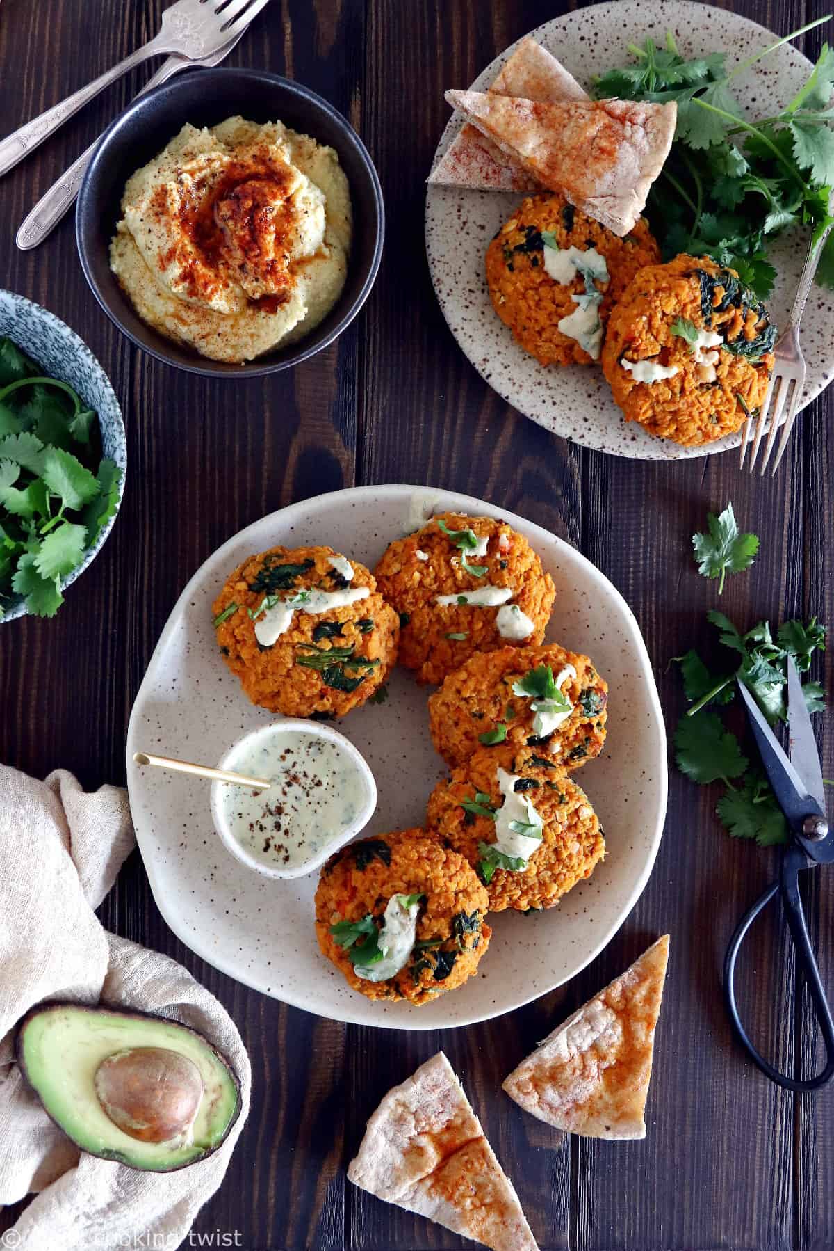Easy and delicious red lentil patties served with a garlic-herb tahini sauce. Both vegan and gluten-free, these veggie patties are bursting with savory flavors, hearty texture, and oodles of plant-based protein.