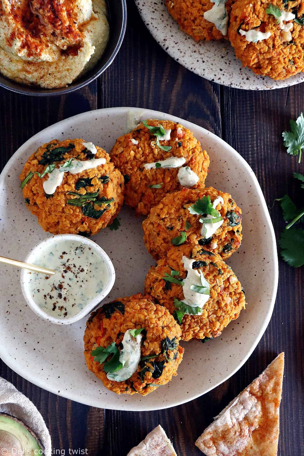 Easy and delicious red lentil patties served with a garlic-herb tahini sauce. Both vegan and gluten-free, these veggie patties are bursting with savory flavors, hearty texture, and oodles of plant-based protein.