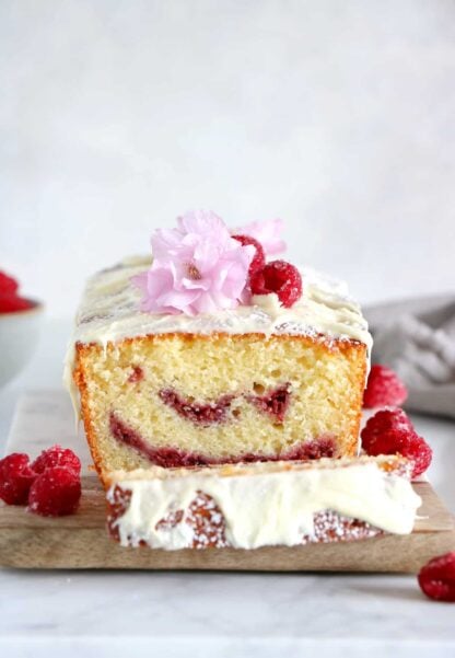 Delicious and easy to make, this white chocolate raspberry marble cake is filled with jammy raspberry swirls and topped with a generous and sweet layer of white chocolate.