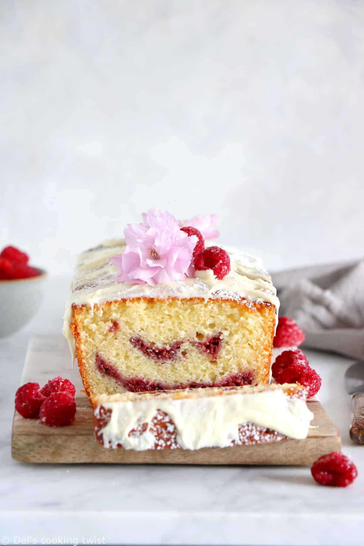 Delicious and easy to make, this white chocolate raspberry marble cake is filled with jammy raspberry swirls and topped with a generous and sweet layer of white chocolate.