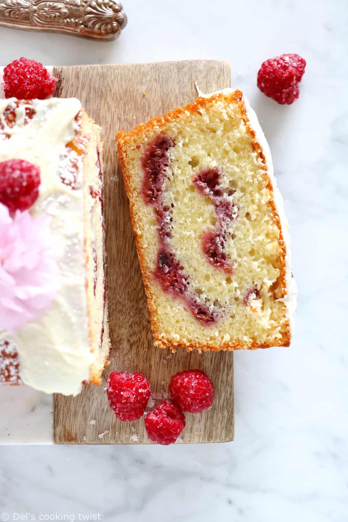 Delicious and easy to make, this white chocolate raspberry marble cake is filled with jammy raspberry swirls and topped with a generous and sweet layer of white chocolate.