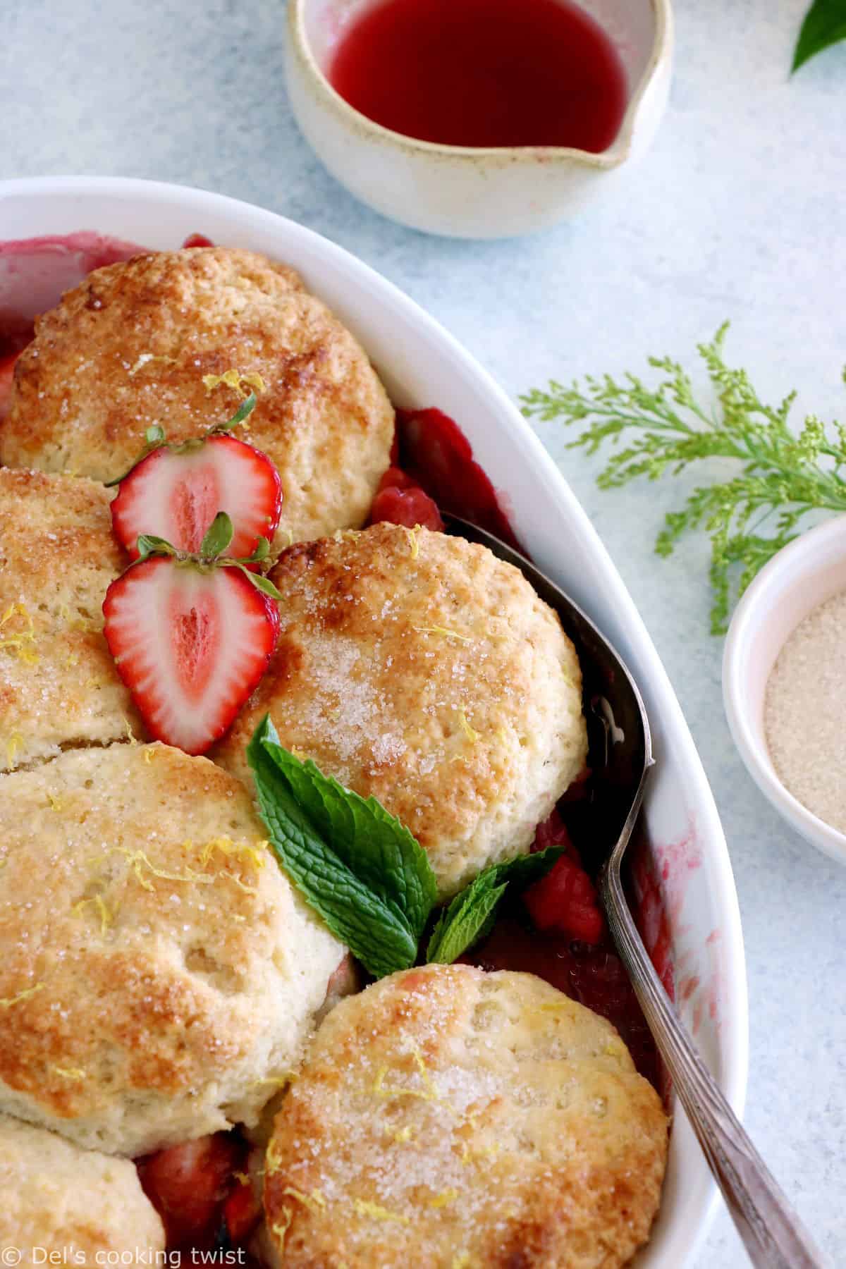 This rhubarb, strawberry, apple cobbler features a sweet and tangy fruity filling topped with some flaky dropped biscuits.