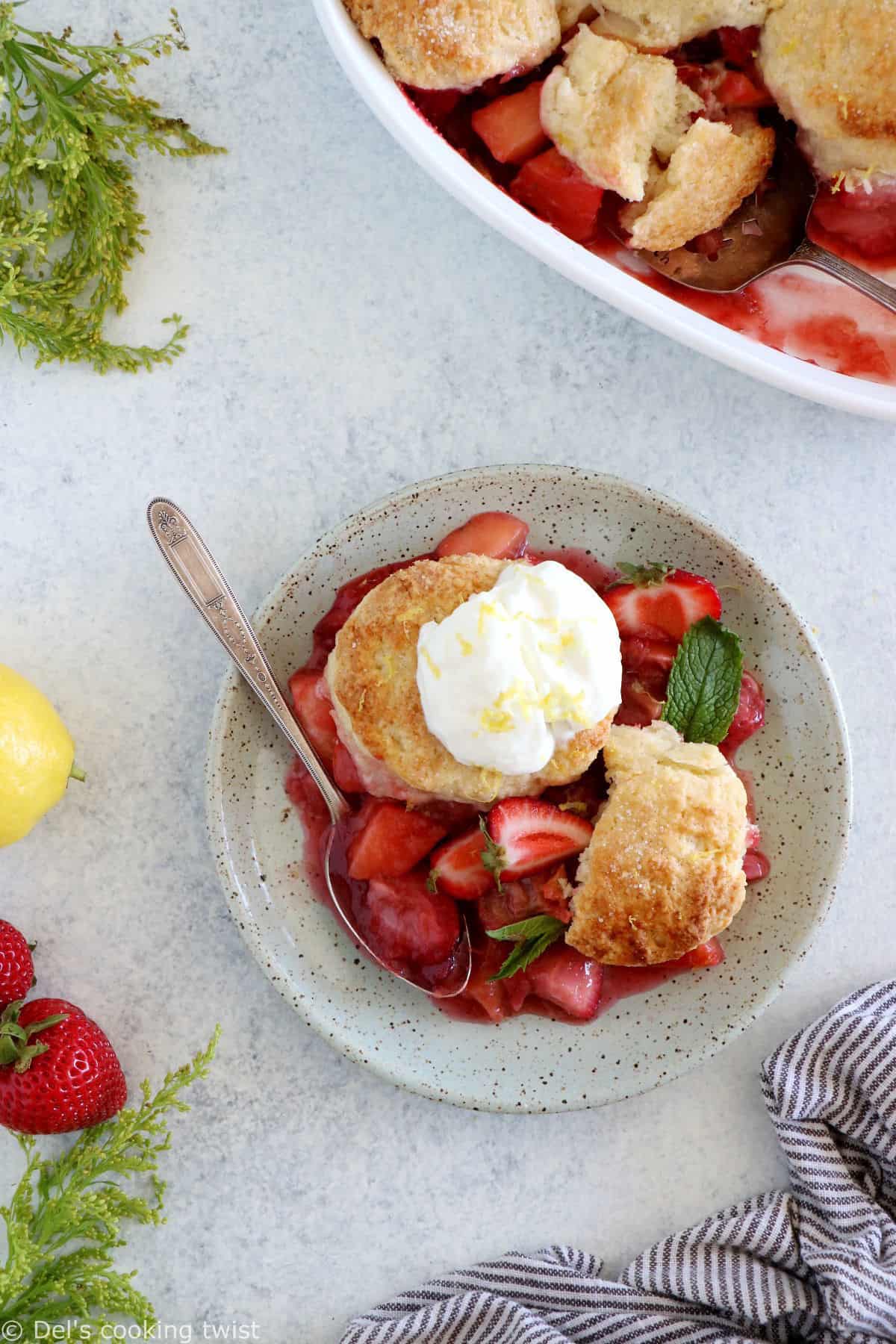 This rhubarb, strawberry, apple cobbler features a sweet and tangy fruity filling topped with some flaky dropped biscuits.