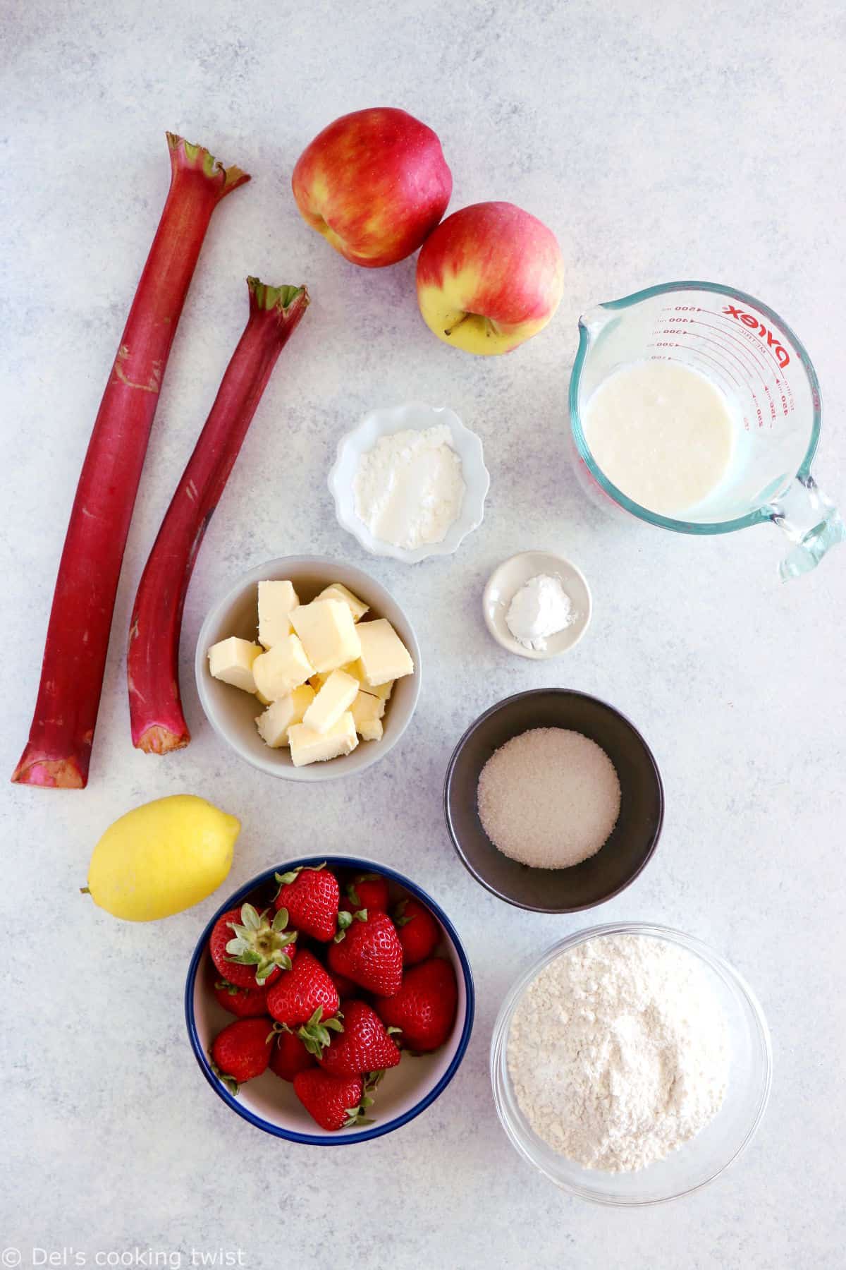 This rhubarb, strawberry, apple cobbler features a sweet and tangy fruity filling topped with some flaky dropped biscuits.