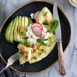 This simple mint ricotta omelet is light, fluffy, and subtly flavored with fresh mint leaves. It doesn't get any more complicated than that.