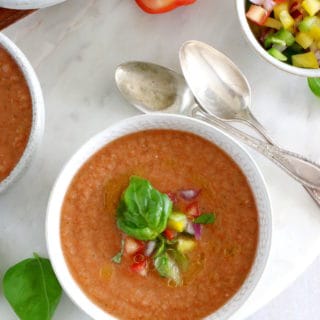 Cool off with this easy 10-minute gazpacho recipe. Prepared with sun-ripe tomatoes and other summer vegetables mixed in a blender with other seasoning, this chilled soup is super refreshing and bursting with fresh-from-the-garden flavors.