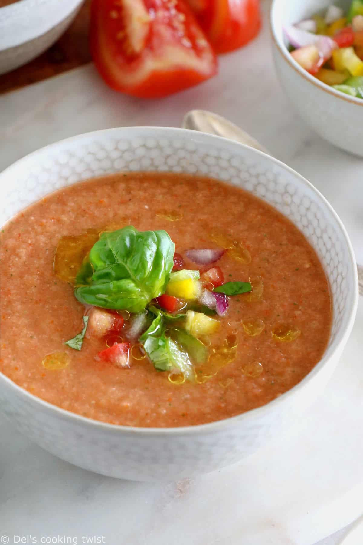 Cool off with this easy 10-minute gazpacho recipe. Prepared with sun-ripe tomatoes and other summer vegetables mixed in a blender with other seasoning, this chilled soup is super refreshing and bursting with fresh-from-the-garden flavors.