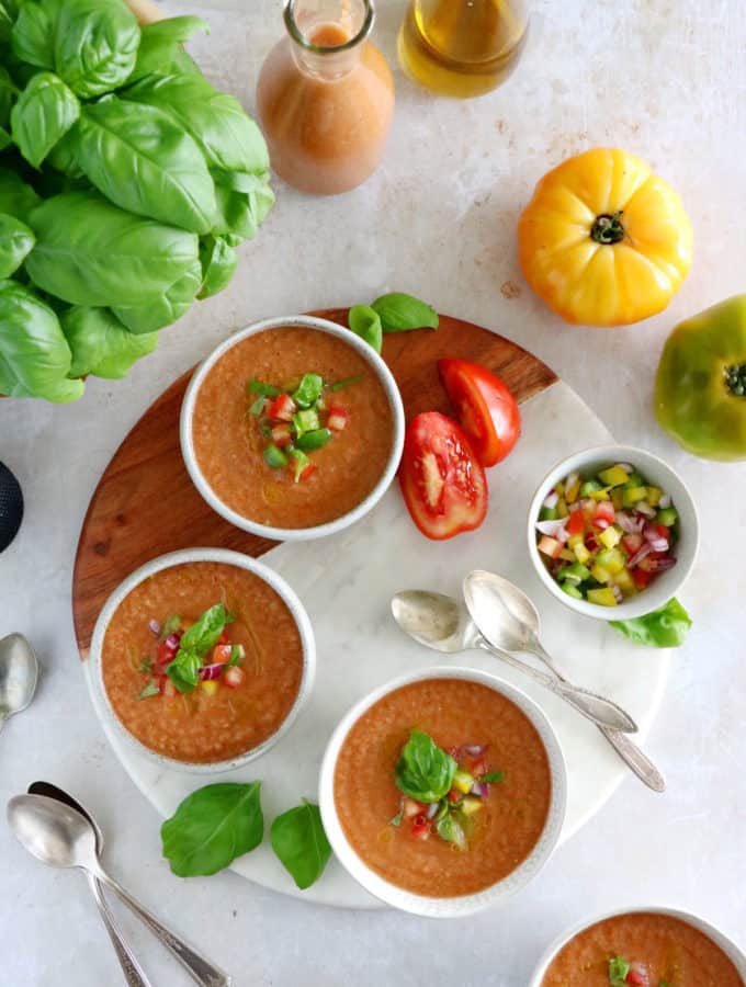 Cool off with this easy 10-minute gazpacho recipe. Prepared with sun-ripe tomatoes and other summer vegetables mixed in a blender with other seasoning, this chilled soup is super refreshing and bursting with fresh-from-the-garden flavors.