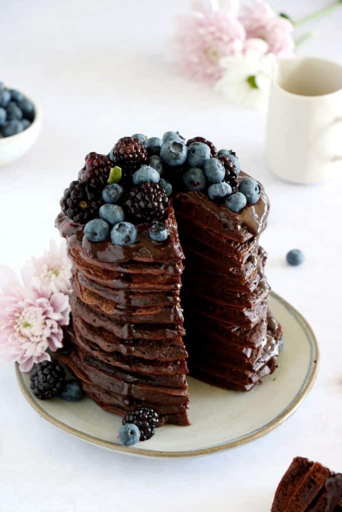 Perfect chocolate pancakes are easy to make, fluffy, and topped with a rich hot chocolate sauce.