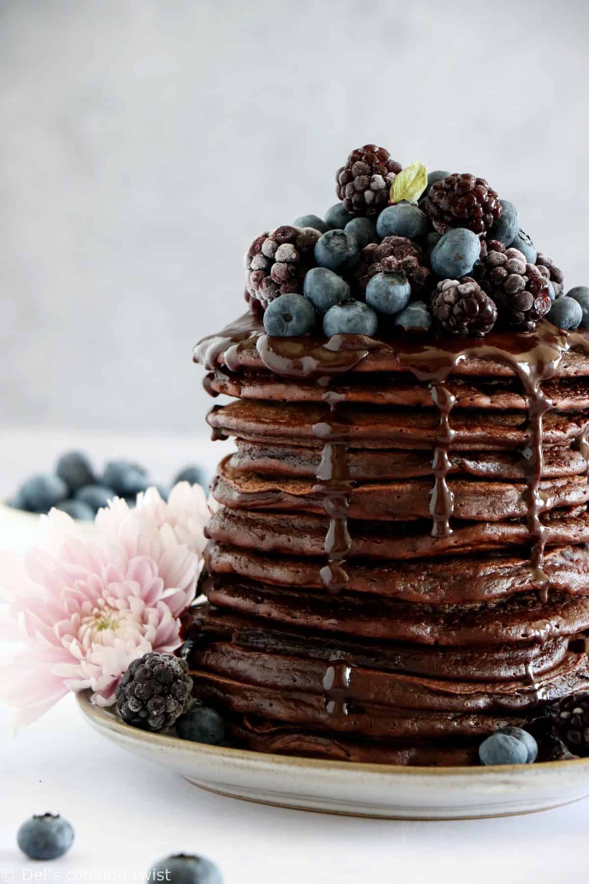 Perfect chocolate pancakes are easy to make, fluffy, and topped with a rich hot chocolate sauce.