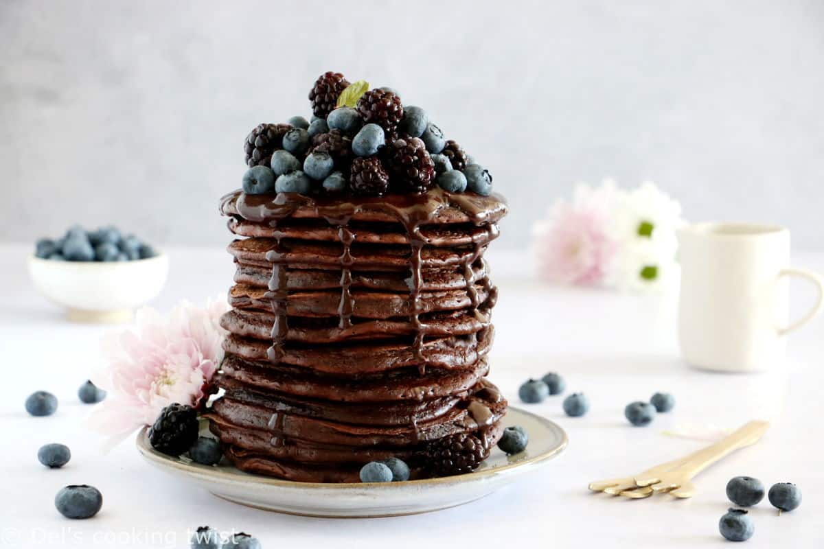 Perfect chocolate pancakes are easy to make, fluffy, and topped with a rich hot chocolate sauce.