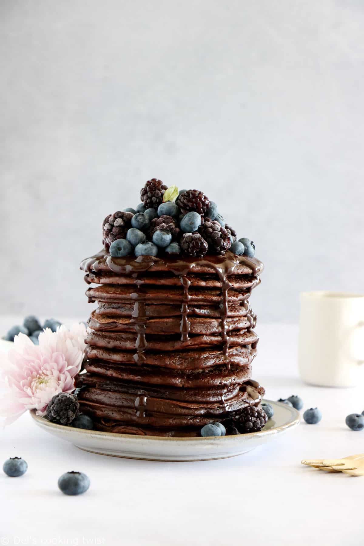 Perfect chocolate pancakes are easy to make, fluffy, and topped with a rich hot chocolate sauce.