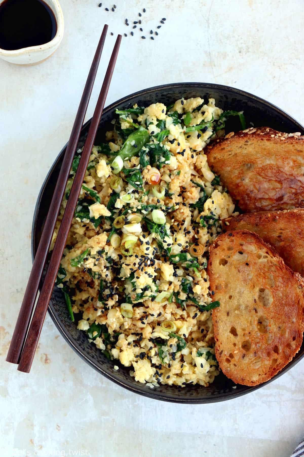 Quick and easy to prepare, this scrambled egg cauliflower fried rice makes for a healthier lunch, loaded with veggies, protein-rich, and naturally gluten-free.