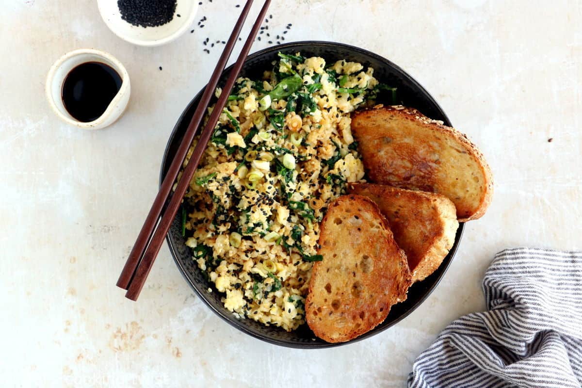 Quick and easy to prepare, this scrambled egg cauliflower fried rice makes for a healthier lunch, loaded with veggies, protein-rich, and naturally gluten-free.