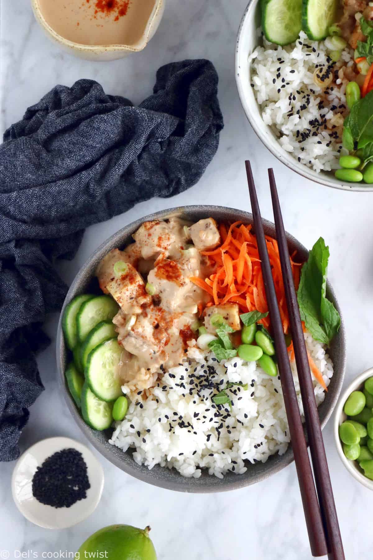 This easy spicy peanut tofu power bowl is vegan, gluten-free, high in plant-based protein and packed with good-for-you ingredients.