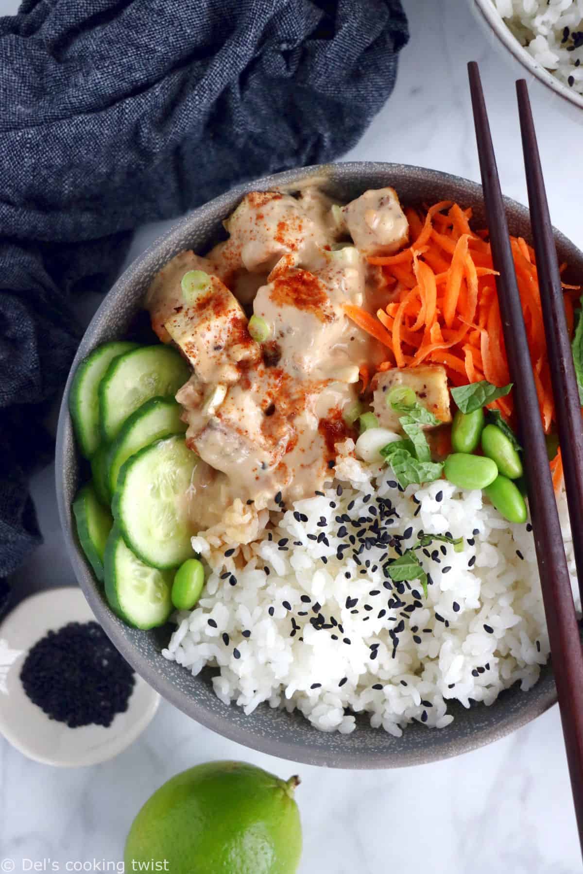 This easy spicy peanut tofu power bowl is vegan, gluten-free, high in plant-based protein and packed with good-for-you ingredients.