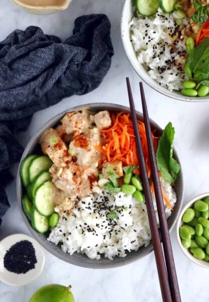 This easy spicy peanut tofu power bowl is vegan, gluten-free, high in plant-based protein and packed with good-for-you ingredients.