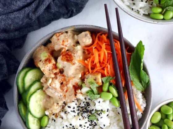 This easy spicy peanut tofu power bowl is vegan, gluten-free, high in plant-based protein and packed with good-for-you ingredients.