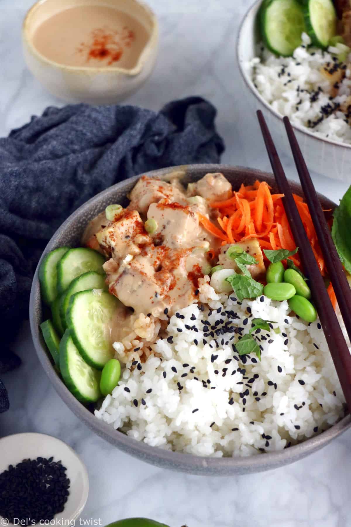 This easy spicy peanut tofu power bowl is vegan, gluten-free, high in plant-based protein and packed with good-for-you ingredients.