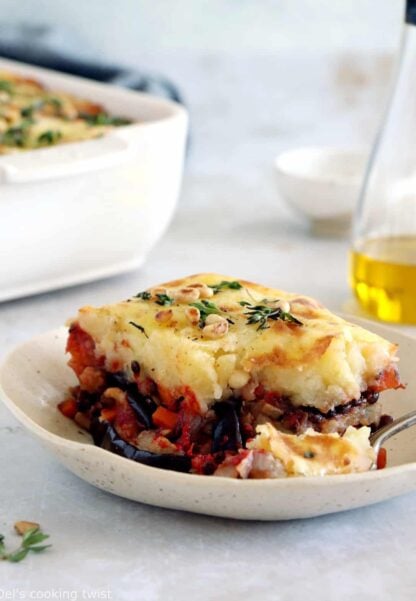 This vegetarian moussaka has some deep smoky flavors, with layers of eggplants, potatoes, spiced vegetarian meat, and a creamy bechamel sauce.