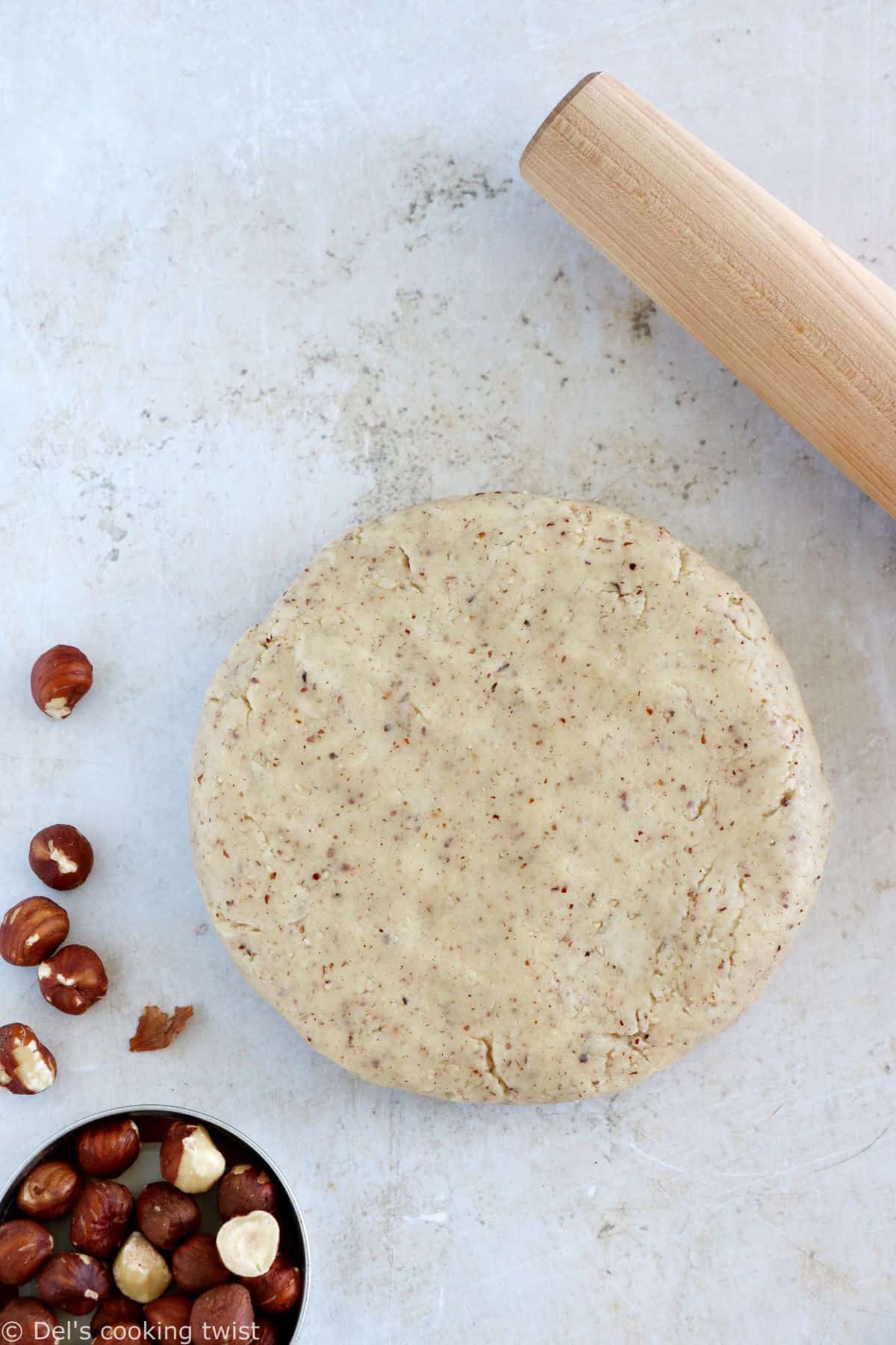 Hazelnut pie crust is a sweet shortcrust pastry prepared with ground hazelnuts. The dough comes together easily with just a few ingredients and has a subtle nutty flavor.