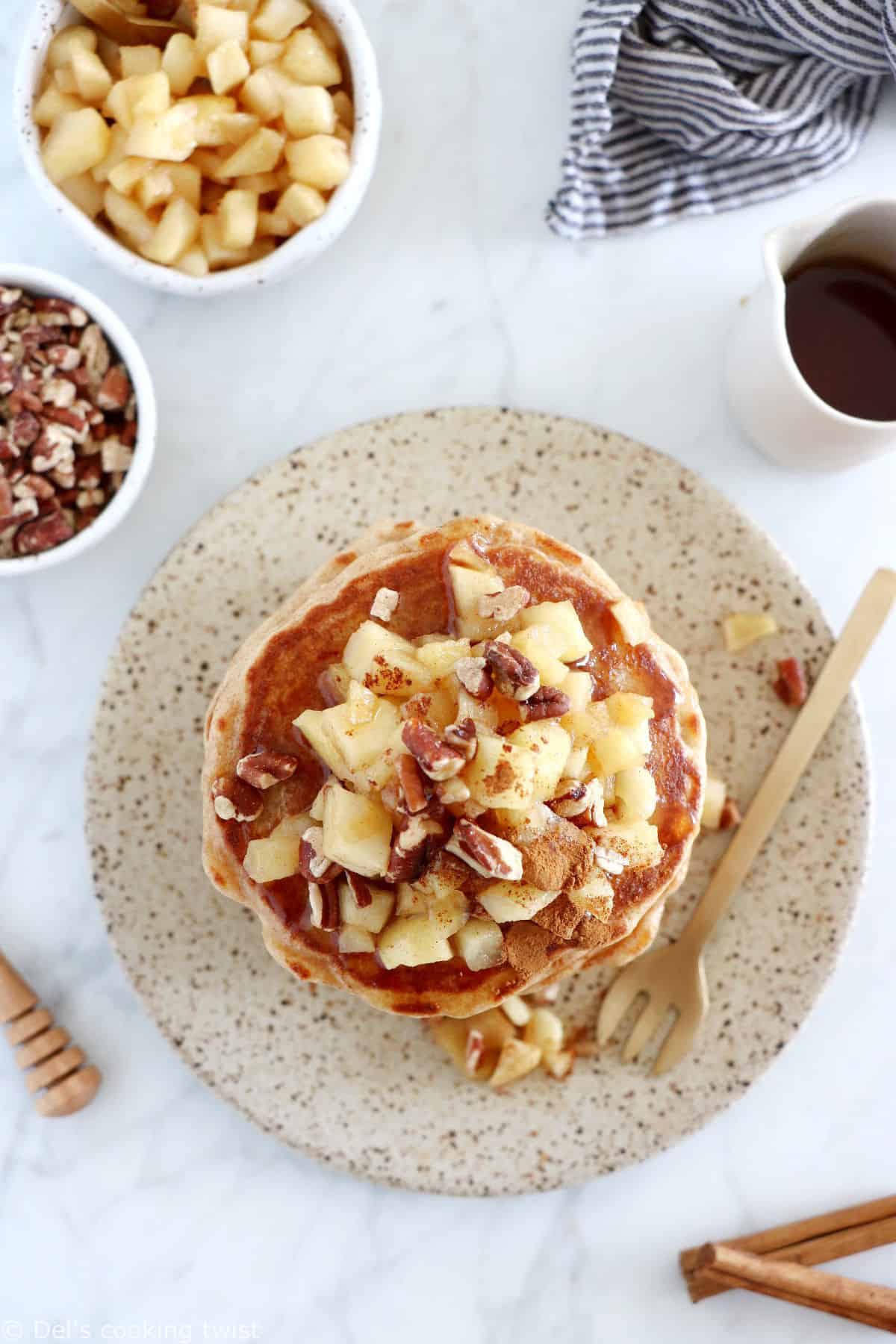 Healthy apple pancakes are prepared with shredded apples and a mix of whole wheat flour and almond flour to make them more nutritious.