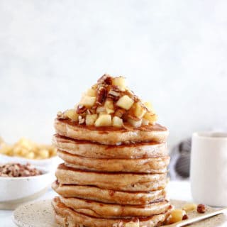 Healthy apple pancakes are prepared with shredded apples and a mix of whole wheat flour and almond flour to make them more nutritious.