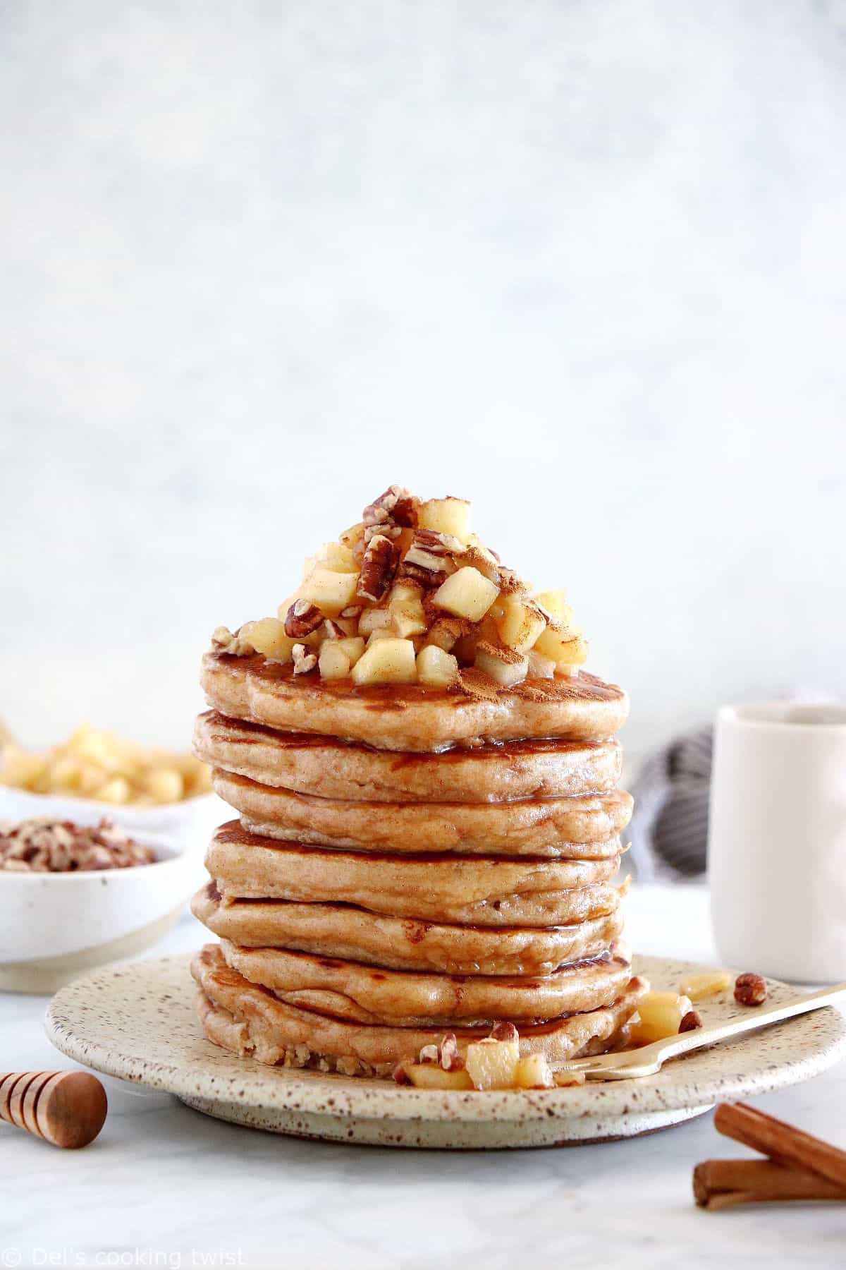 Healthy apple pancakes are prepared with shredded apples and a mix of whole wheat flour and almond flour to make them more nutritious.