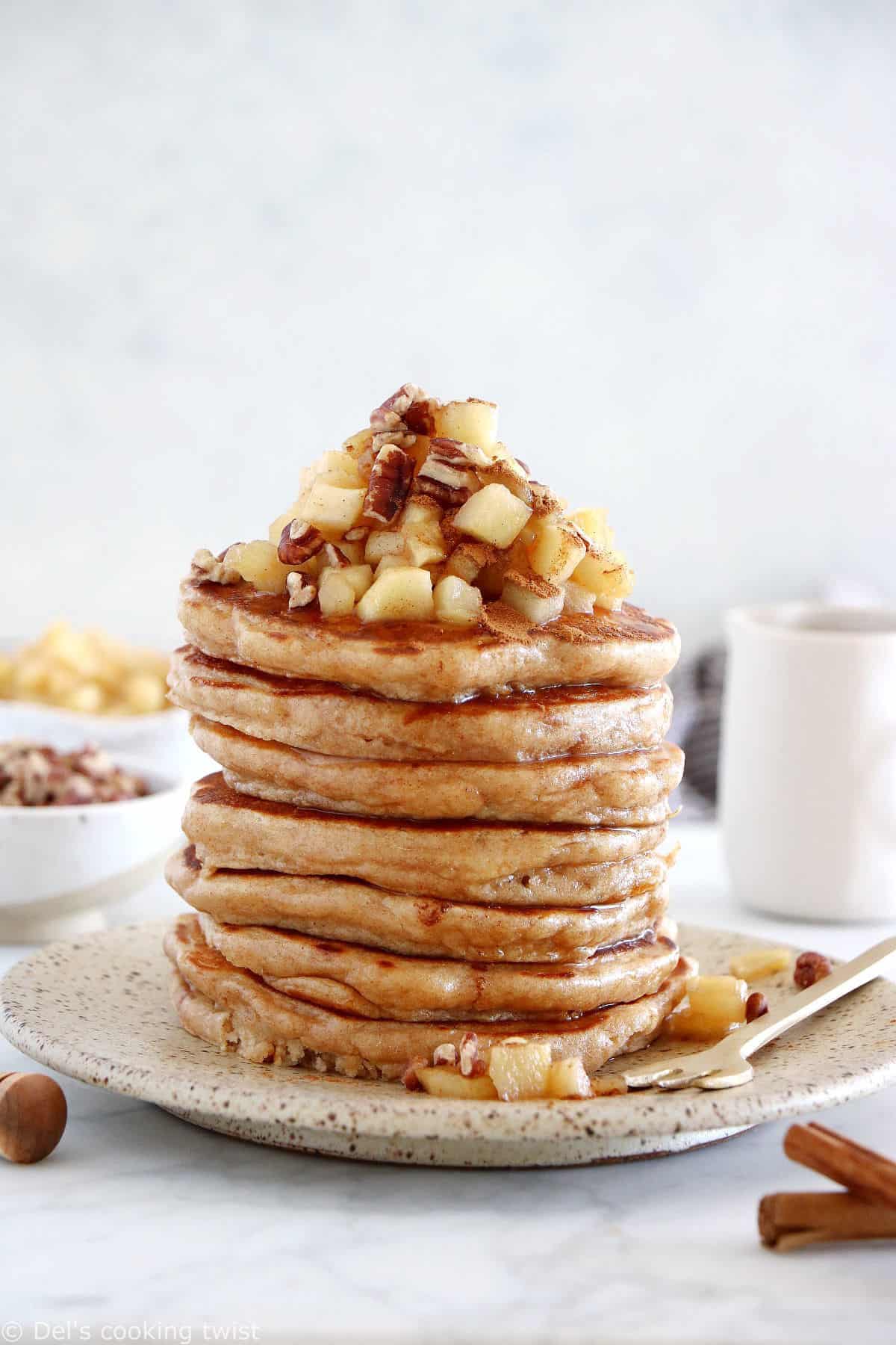 Healthy apple pancakes are prepared with shredded apples and a mix of whole wheat flour and almond flour to make them more nutritious.