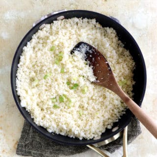 Learn how to make cauliflower rice from scratch, following an easy step-by-step guide. Quick to prepare and healthy, this grain-free and low carb recipe is life changing.