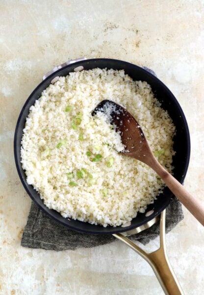 Learn how to make cauliflower rice from scratch, following an easy step-by-step guide. Quick to prepare and healthy, this grain-free and low carb recipe is life changing.