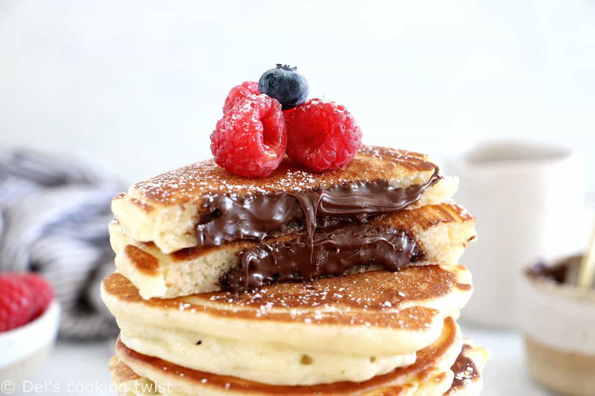 Nutella-stuffed pancakes are a dream come true! Imagine a stack of pillowy soft, fluffy pancakes, oozing with a warm chocolate center.