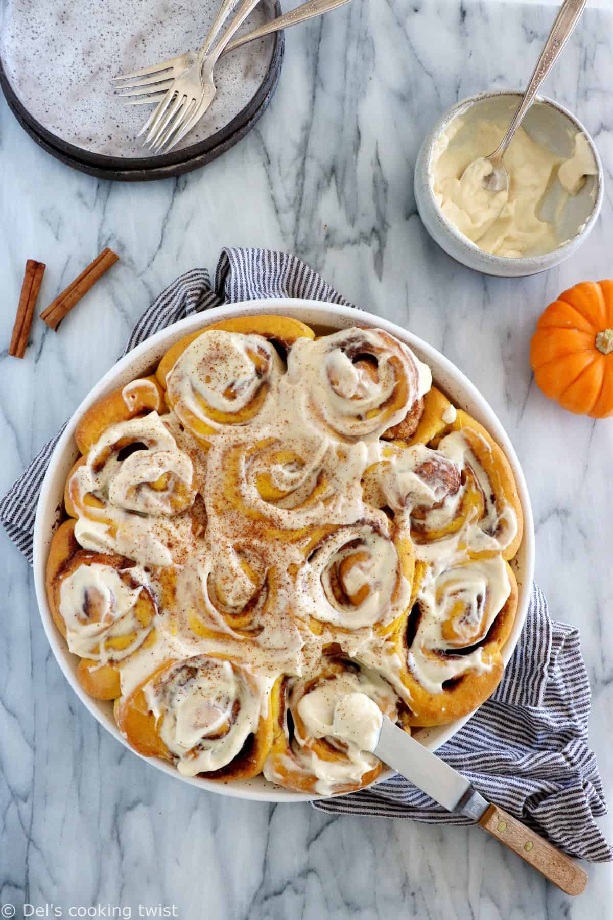 These pumpkin cinnamon rolls are soft, pillowy, prepared with real pumpkin puree, and loaded with warm pumpkin spice.