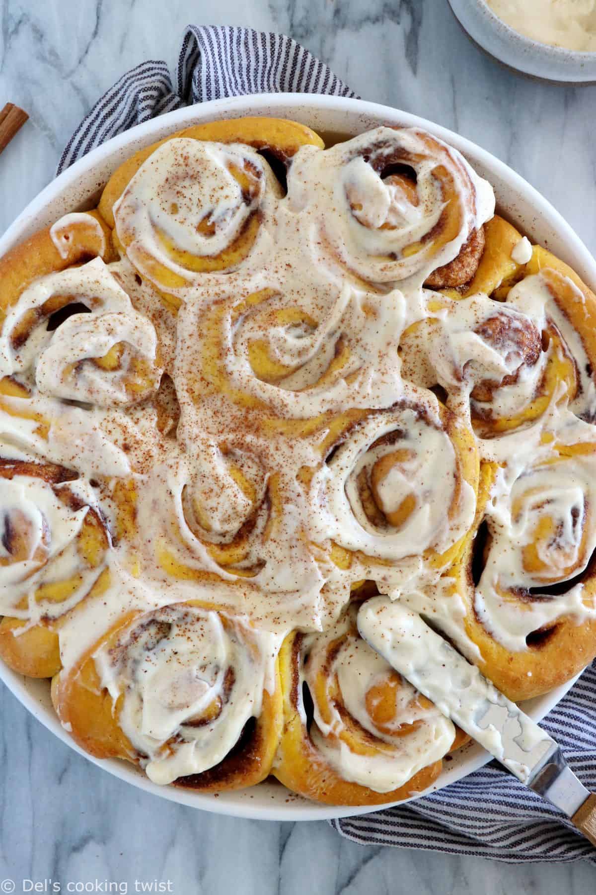 These pumpkin cinnamon rolls are soft, pillowy, prepared with real pumpkin puree, and loaded with warm pumpkin spice.