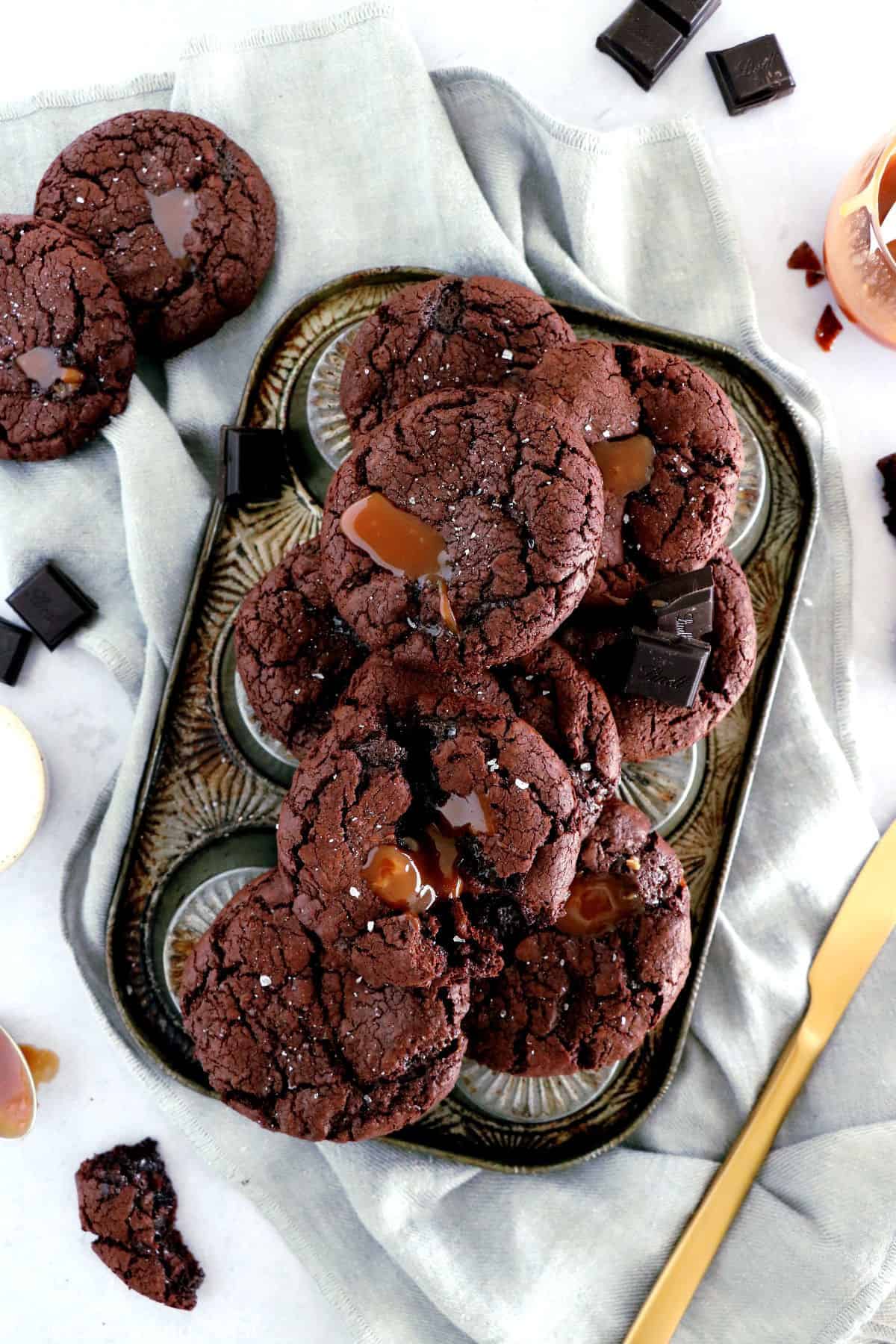 Salted caramel stuffed brownie cookies are slightly crinkly on top, fudgy, loaded with chocolate, with a gooey salted caramel center.