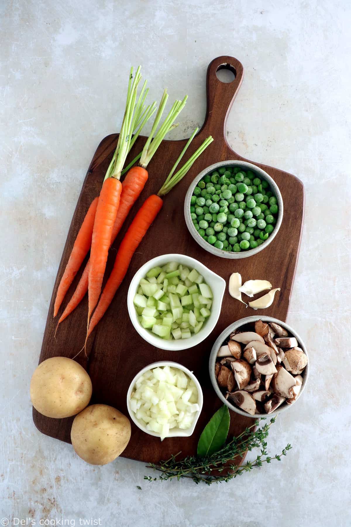A rustic vegetarian pot pie loaded with hearty veggies coated in a creamy gravy, and tucked in between two crunchy flaky pie crusts.