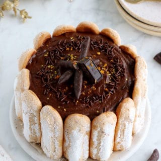 The French chocolate charlotte is an elegant no-bake dessert featuring Ladyfingers and a rich chocolate mousse.