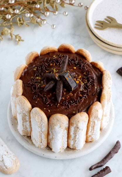 The French chocolate charlotte is an elegant no-bake dessert featuring Ladyfingers and a rich chocolate mousse.