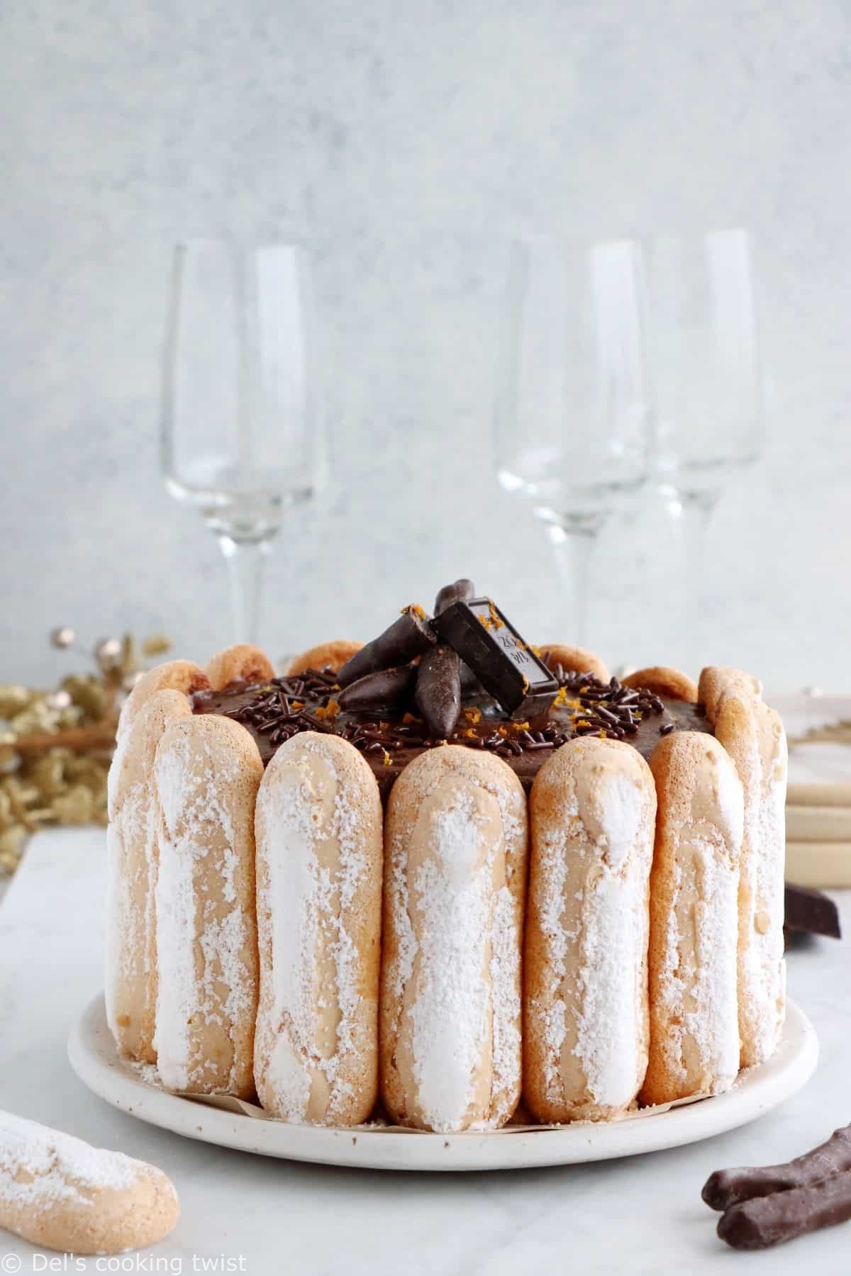 The French chocolate charlotte is an elegant no-bake dessert featuring Ladyfingers and a rich chocolate mousse.