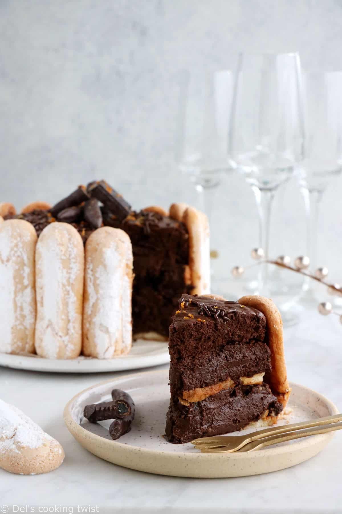 The French chocolate charlotte is an elegant no-bake dessert featuring Ladyfingers and a rich chocolate mousse.