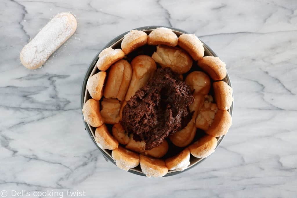 The French chocolate charlotte is an elegant no-bake dessert featuring Ladyfingers and a rich chocolate mousse.