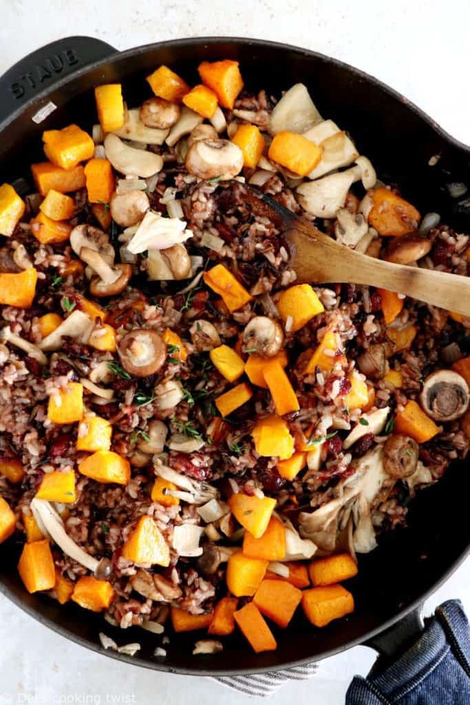 Wild rice stuffed acorn squash is an easy, healthy and nutritious vegetarian dish featuring roasted acorn squash halves filled with wild rice, mushrooms and cranberries.