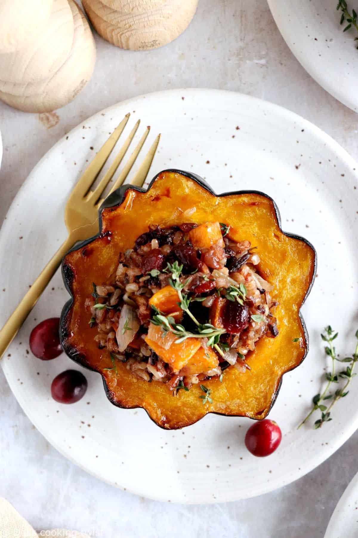 Wild rice stuffed acorn squash is an easy, healthy and nutritious vegetarian dish featuring roasted acorn squash halves filled with wild rice, mushrooms and cranberries.