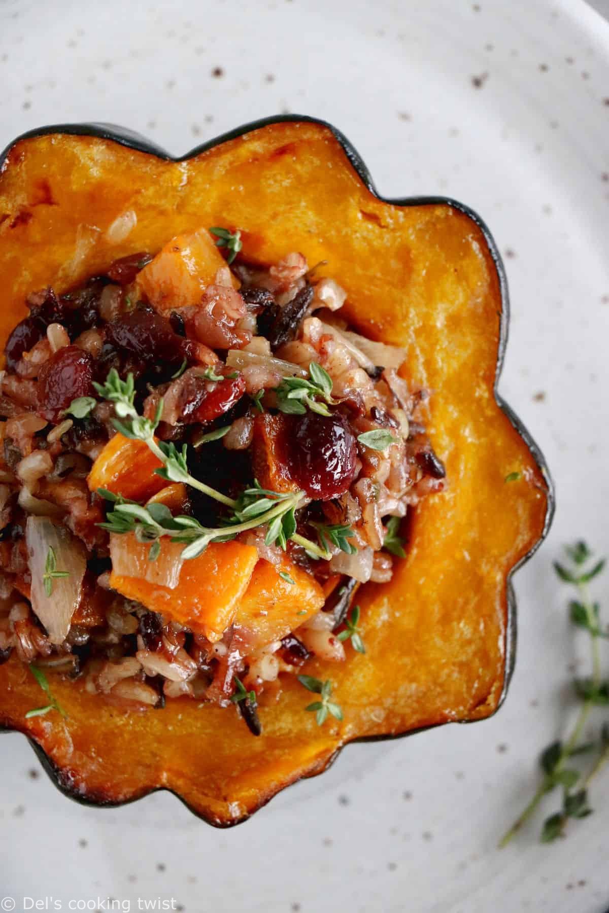 Wild rice stuffed acorn squash is an easy, healthy and nutritious vegetarian dish featuring roasted acorn squash halves filled with wild rice, mushrooms and cranberries.