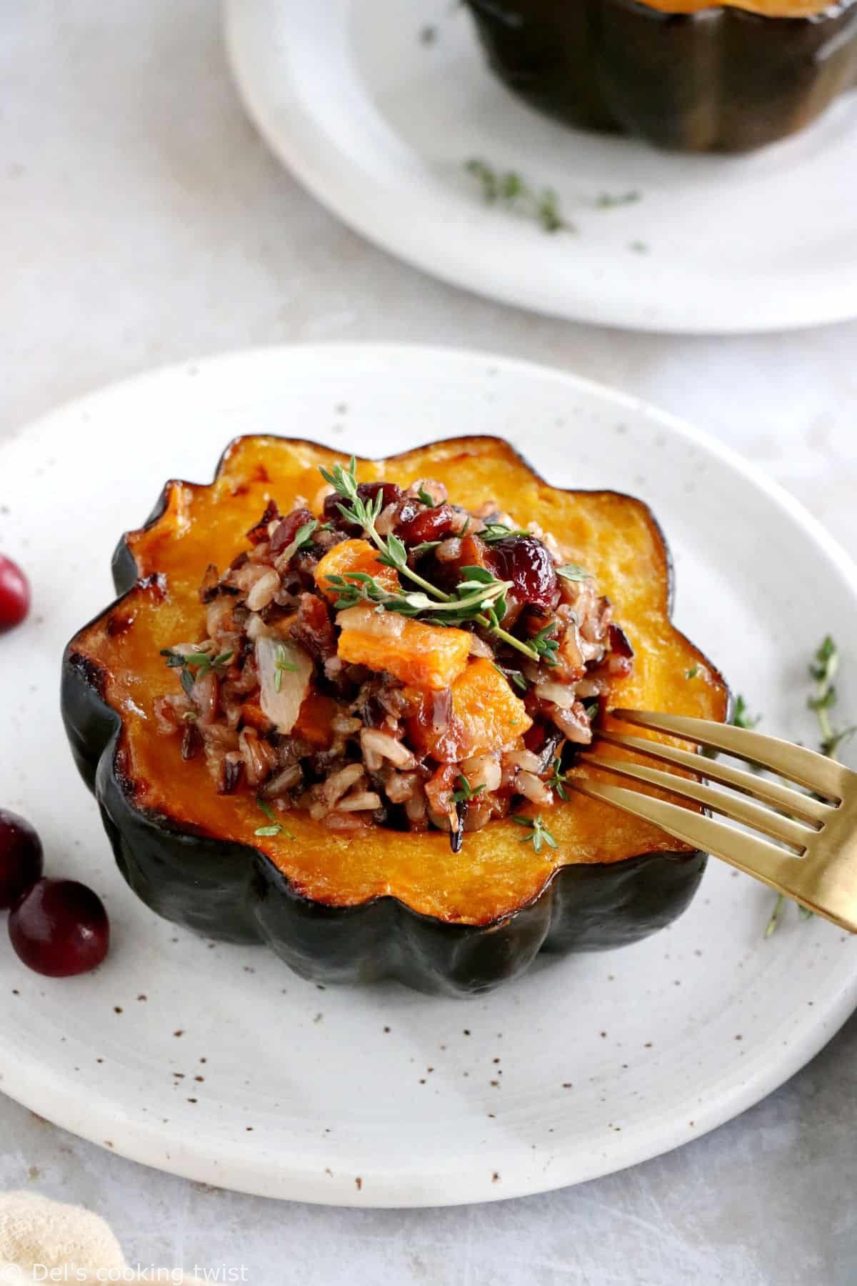 Wild rice stuffed acorn squash is an easy, healthy and nutritious vegetarian dish featuring roasted acorn squash halves filled with wild rice, mushrooms and cranberries.