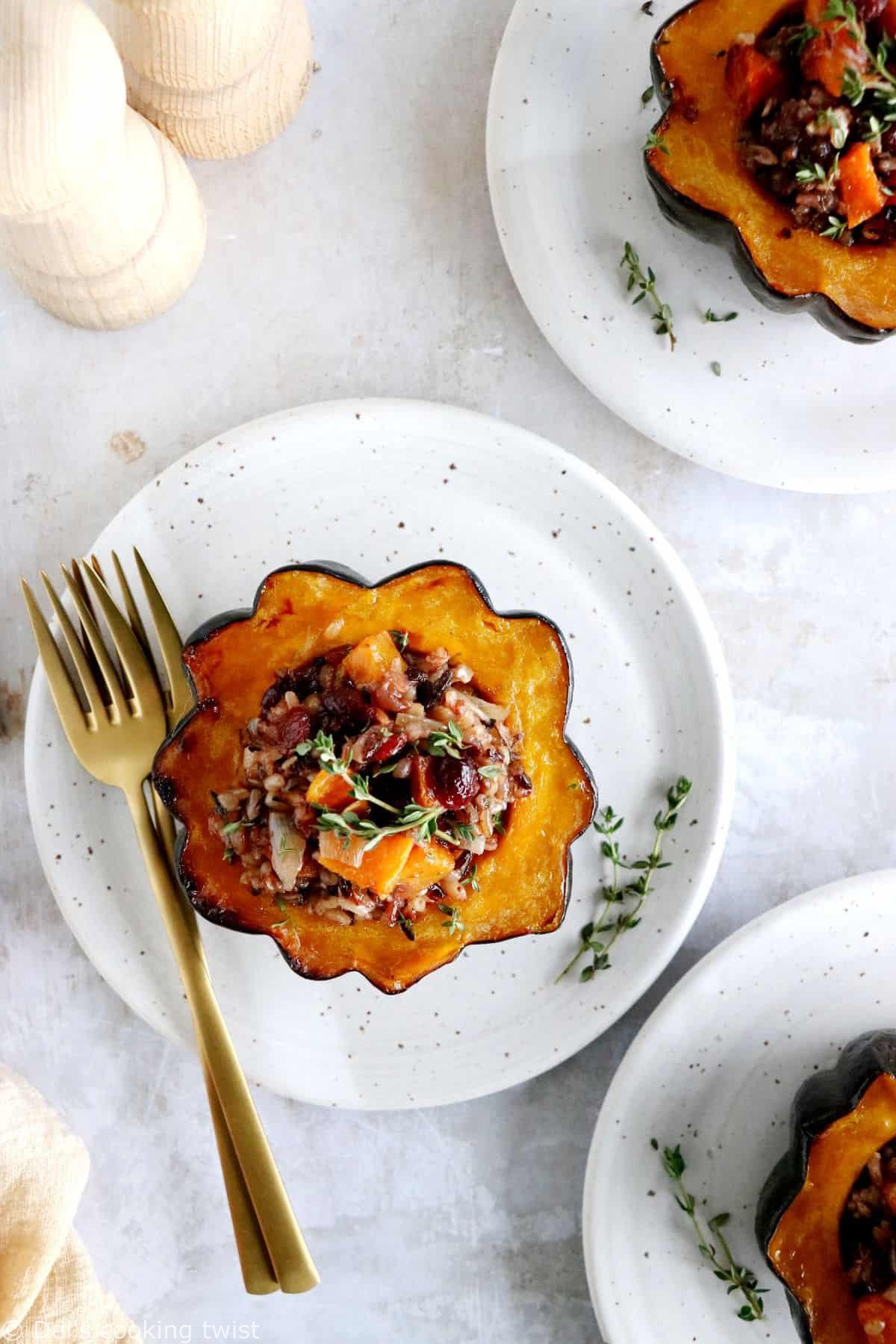 Wild rice stuffed acorn squash is an easy, healthy and nutritious vegetarian dish featuring roasted acorn squash halves filled with wild rice, mushrooms and cranberries.