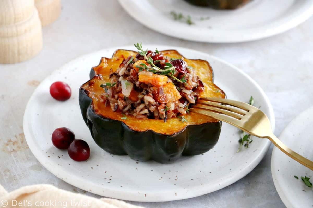 Wild rice stuffed acorn squash is an easy, healthy and nutritious vegetarian dish featuring roasted acorn squash halves filled with wild rice, mushrooms and cranberries.