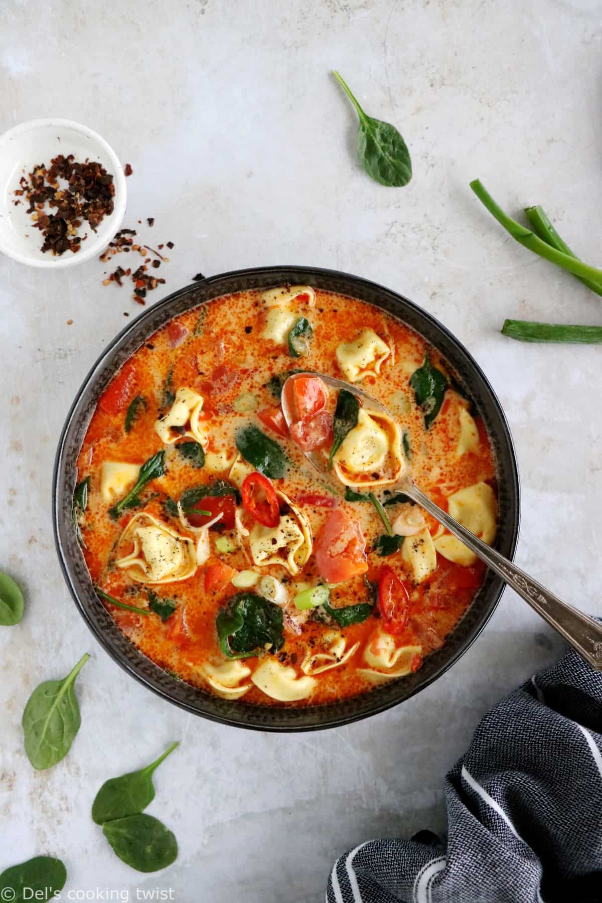 Thai red curry tortellini soup is fusion food at its finest, resulting from Thai cuisine meeting the Italian one.