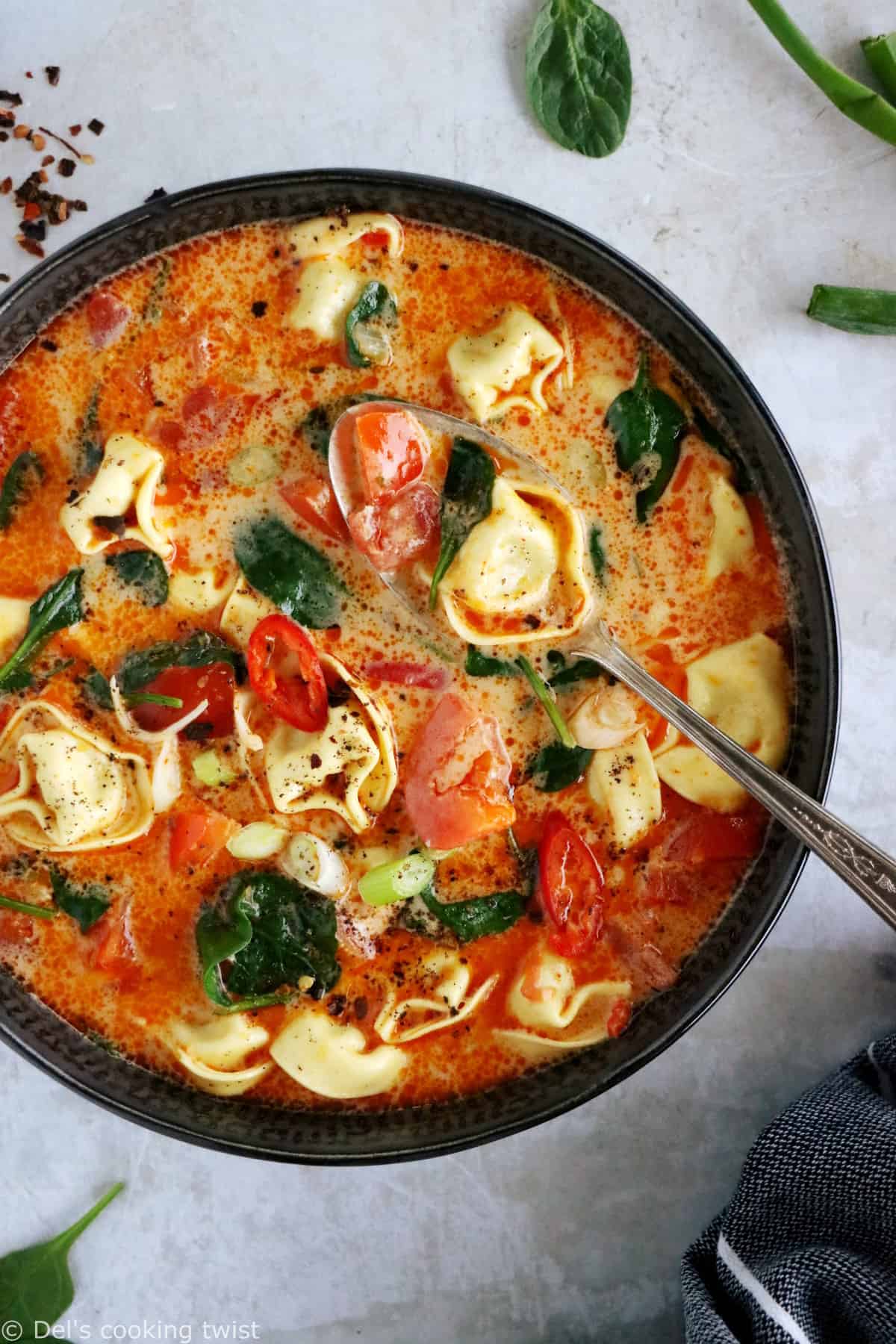 Thai red curry tortellini soup is fusion food at its finest, resulting from Thai cuisine meeting the Italian one.